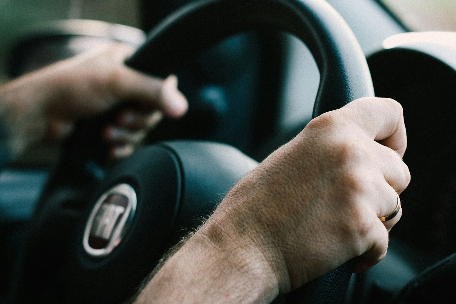 man driving Fiat car, auto